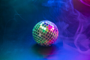 A vibrant disco image showcasing a disco ball amidst colorful, bubbly effects and smoky atmosphere, symbolizing fun, celebration, and nightlife energy
