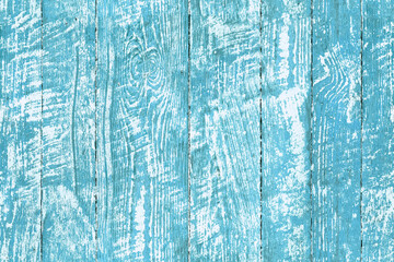 Peeling paint wood - blue background pattern. Vintage feel patina wooden seamless texture highlighting the wood grain. Natural rustic backdrop depicting a weathered surface made of slats of lumber.