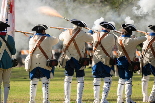 Revolution soldiers firing their muskets during an reenactment