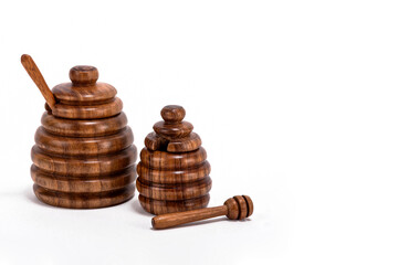 Wooden honey container isolated on white background with space for text, wooden honeycomb craft, honey jar