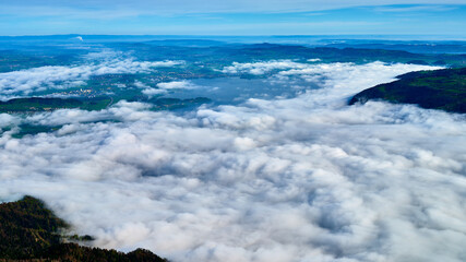 Breathtaking view over a sea of clouds from a high mountain landscape in the morning light showcasing the beauty of nature