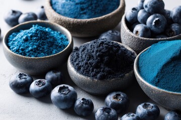 Still life of blueberries and blueberry powder in rustic bowls, vibrant blue hues, showcasing a healthy and natural food source against a simple, modern backdrop.