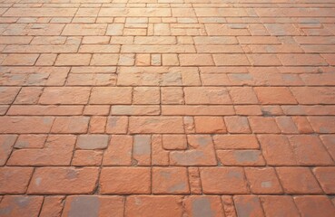 Orange paving slabs with square pattern. Textured stone floor, brick-like texture. Rough surface, outdoor construction. Retro style, vintage, old, grunge, concrete.