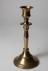 Vintage brass candlestick, studio shot, isolated on white background
