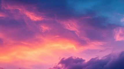 Vibrant and colorful sky with dramatic clouds in hues of pink, purple, orange, and blue during sunset or sunrise, evoking a serene and majestic atmosphere