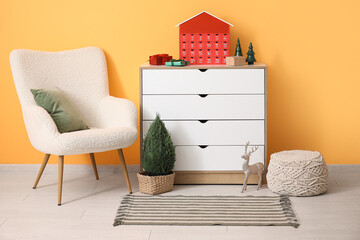 Interior of living room with armchair, commode and Christmas Advent calendar