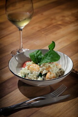 Risotto with arugula and shrimp, an Italian classic on a plate