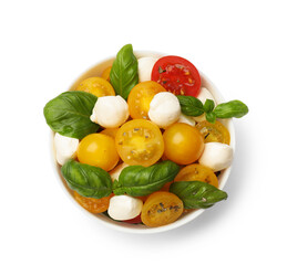 Fresh salad with yellow tomatoes, basil and mozzarella cheese in bowl isolated on white, top view