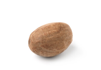 One whole fresh nutmeg isolated on white