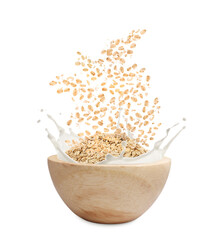 Oats and milk splashing out from bowl on white background