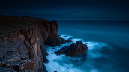 Naklejka premium Dark Coast Cliffs with Ocean Waves.