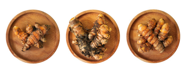 set of turmeric on a wooden plate isolated on white
