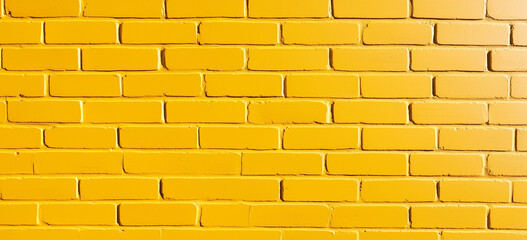 Vibrant Yellow Brick Wall Bright sunny yellow painted brick texture creating an energetic abstract background perfect for cheerful and eye-catching designs.
