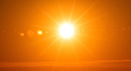 Obraz premium Radiant Sunrise: A Glowing Orb of Sunshine Illuminates the Horizon