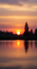 Blurred sunset ablaze over tranquil waters