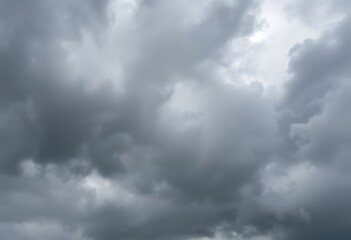 Obraz premium couple of sheep standing on top of a field under a cloudy sky
