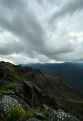 view of a mountain range with a cloudy sky