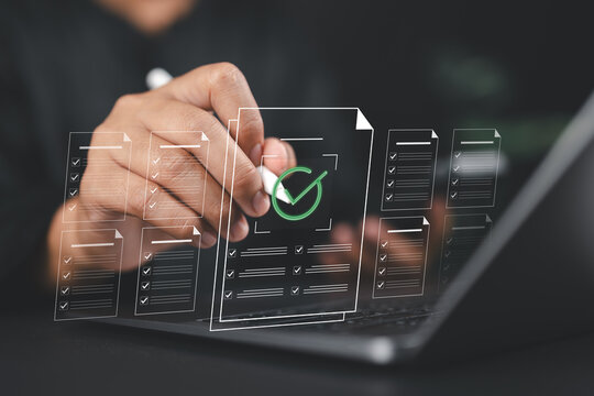 Businessman finger selecting digital document with check mark icon, representing paperless workflow, approval process, document management, e-signature and modern business operation. - Powered by Adobe