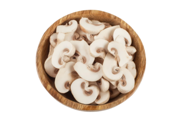 Fresh mushroom champignon slices in a wooden bowl isolated
