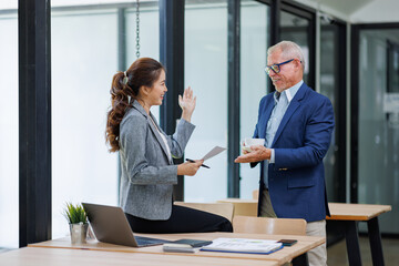 Happy business people smiling business man and  business women working together in office
