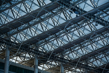 Fototapeta premium Close-up of the stadium ceiling. Modern architecture, modern city building. Exterior design. Details of modern architecture. Building abstract. Building background.