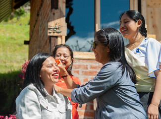 Latin american women sharing a playful moment outdoors