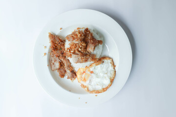 stir fried pork with garlic , pork and rice or deep fried pork or fried pork with rice and sunny side up egg or fried egg
