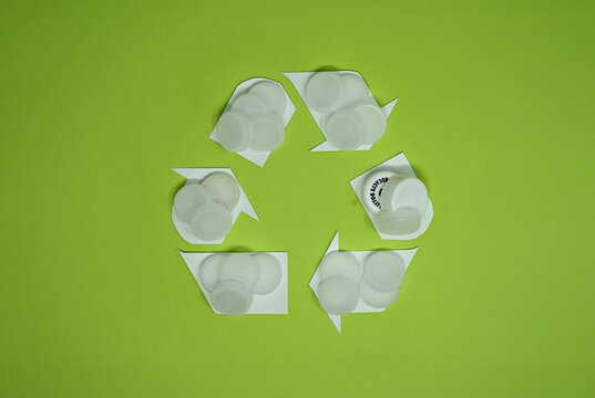 White Bottle Caps In Recycling Icon Design