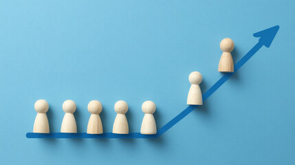 Obraz premium Wooden Figures Ascending Blue Arrow Growth Concept