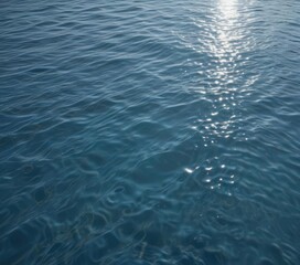 Obraz premium Serene blue water, gentle ripple, sunlit surface, clear, ocean