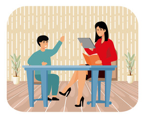 Teacher Assisting Young Student With Learning in a Classroom Setting.