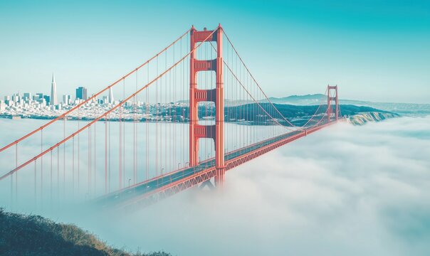 Golden Gate Bridge emerging from fog with San Francisco skyline in background