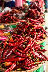 Big piles of dry red peppers for sale at a market in Myanmar