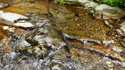 Valley for Summer Vacation ,Slow Motion ,Clear Stream flowing over rocks and rocks ,Rich Valley in slow motion ,Crystal clear water spills over rocks ,Silent natural scene ,Silent flowing riverbed