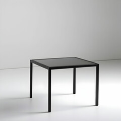 A sleek black metal end table with a glass top.
