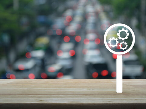 Seo flat icon on wooden table over blur of rush hour with cars and road, Search engine optimization concept