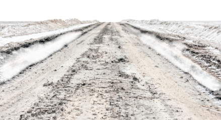 Png of A rugged dirt road stretches into the distance, framed by snow-covered banks, evoking a sense of adventure and solitude.