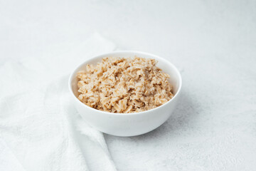 Delicious bowl of oatmeal topped with spices in a bright kitchen setting