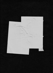 Scattered white paper strips forming dense diagonal and horizontal patterns over black fabric. Clean, modern, and dynamic layout for abstract visual design.