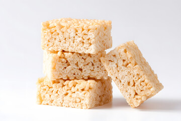 Rice Krispie square treat, light and crispy squares made from puffed rice cereal isolated on white