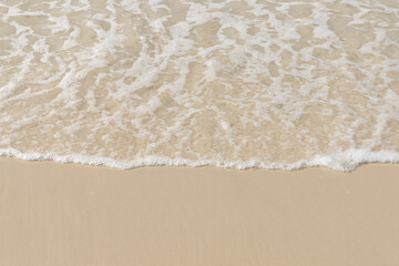 Soft wave  on sandy beach. Background.