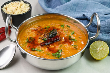 Serving dal tadka dish in a bowl.