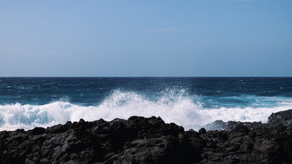 Rocky coast of the Atlantic ocean with waves.