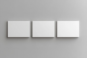 Three Blank White Canvas Prints on Gray Wall Modern Minimalist Home Decor Gallery Wall Mockup Empty Artwork Space Simple