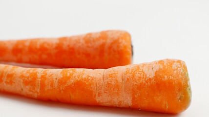 fresh carrots on a plate isolated in white background.  healthy food for kids and vegan. fresh vegetables for cooking.