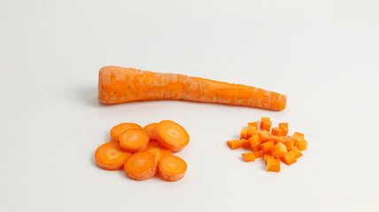slice fresh carrots on a plate isolated in white background.  healthy food for kids and vegan. fresh vegetables for cooking.