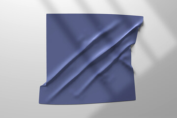 A minimal mockup featuring a draped indigo fabric pinned on a light grey wall, with soft shadows adding depth and realism. This scene is ideal for showcasing textile designs, logo placements, fabric b