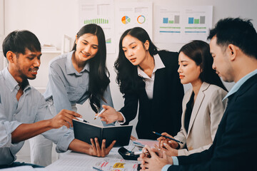 Team of financial advisory services. Asian advisor showing plan of investment to clients in the consultancy office..
