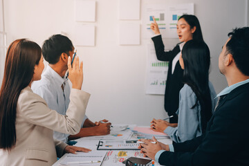 Team of financial advisory services. Asian advisor showing plan of investment to clients in the consultancy office..