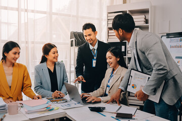 Team of financial advisory services. Asian advisor showing plan of investment to clients in the consultancy office..